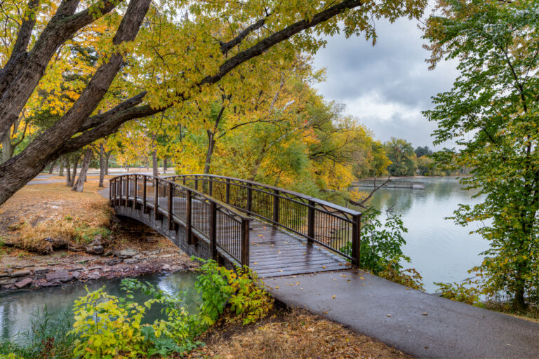 Walking bridge in autumn over Lake Nokomis in Minneapolis, Minnesota.